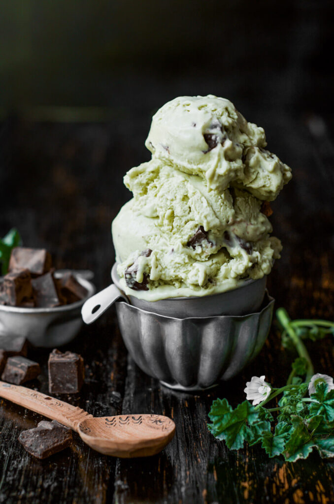 Scoops of creamy dairy-free mint chocolate ice cream in a bowl — a no-bake gluten-free dessert